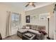 Relaxing living room with a comfortable couch, neutral tones, and lots of natural light at 9486 Elmhurst Ln # D, Highlands Ranch, CO 80129