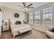 Relaxing main bedroom with bright natural light, a ceiling fan and a bench seat at 9486 Elmhurst Ln # D, Highlands Ranch, CO 80129