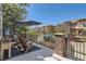 Inviting outdoor patio featuring comfortable seating, shade, and a view of the neighborhood at 9486 Elmhurst Ln # D, Highlands Ranch, CO 80129