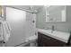 Modern bathroom featuring a glass-enclosed shower, floating vanity, and stylish fixtures at 2430 S Ogden St, Denver, CO 80210