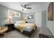 Bright bedroom with ceiling fan, a comfortable queen-size bed, and soft natural light at 2430 S Ogden St, Denver, CO 80210