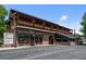 Little India Restaurant with awnings and a second-story balcony, a classic brick building offering authentic Indian cuisine at 2430 S Ogden St, Denver, CO 80210