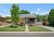 Charming brick home with a well-kept lawn and inviting curb appeal at 2430 S Ogden St, Denver, CO 80210
