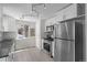 Well-lit kitchen with stainless steel appliances, granite countertops and white cabinetry at 2430 S Ogden St, Denver, CO 80210