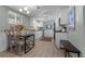 Cozy kitchen with modern track lighting, stainless steel appliances, and adjacent dining area at 2430 S Ogden St, Denver, CO 80210