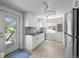 Updated kitchen with stainless steel appliances and a door leading to the deck at 2430 S Ogden St, Denver, CO 80210
