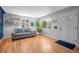 Bright and airy living room with hardwood floors and a comfortable sofa at 2430 S Ogden St, Denver, CO 80210