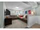 Spacious living room with comfortable seating, large windows, and a wall-mounted television at 2430 S Ogden St, Denver, CO 80210