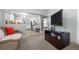 Inviting living room featuring open layout and access to kitchen and bedroom areas at 2430 S Ogden St, Denver, CO 80210