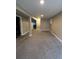 Open finished basement featuring neutral color walls and carpet at 16136 E Exposition Dr, Aurora, CO 80017