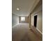 Spacious finished basement with neutral color walls and carpet at 16136 E Exposition Dr, Aurora, CO 80017