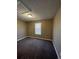 Empty bedroom featuring neutral walls, carpet flooring and a window at 16136 E Exposition Dr, Aurora, CO 80017