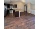 Open kitchen and living room area has granite countertops and stainless appliances at 16136 E Exposition Dr, Aurora, CO 80017