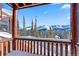Balcony view showcasing snow-covered mountains and evergreen trees at 351 Kimmes Ln, Breckenridge, CO 80424