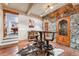 Basement bar area with stone accent wall, unique bar stools and wooden accents at 351 Kimmes Ln, Breckenridge, CO 80424