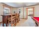 Basement bar area with rustic wooden bar and seating next to the pool table at 351 Kimmes Ln, Breckenridge, CO 80424