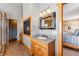 Elegant bathroom featuring a fireplace, granite countertop vanity, and modern fixtures for ultimate relaxation at 351 Kimmes Ln, Breckenridge, CO 80424