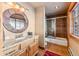 Bathroom featuring a vanity, mirror, and shower at 351 Kimmes Ln, Breckenridge, CO 80424
