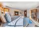 Relaxing bedroom featuring a fireplace and a walk-in closet with natural lighting at 351 Kimmes Ln, Breckenridge, CO 80424