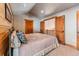 Bedroom featuring a bed, wood trim and doors at 351 Kimmes Ln, Breckenridge, CO 80424