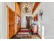 Grand foyer with slate flooring, wood accents, chandelier, and a view of the staircase at 351 Kimmes Ln, Breckenridge, CO 80424