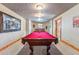 Basement game room featuring a red felt pool table, carpet and ample lighting at 351 Kimmes Ln, Breckenridge, CO 80424