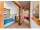 Hallway that leads to two bedrooms and a bedroom window at 351 Kimmes Ln, Breckenridge, CO 80424