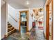 Spacious hallway with slate flooring, wood accents, a view of the kitchen and living room at 351 Kimmes Ln, Breckenridge, CO 80424