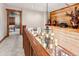 Second floor landing showcasing chandelier, wood paneling and view of the living room at 351 Kimmes Ln, Breckenridge, CO 80424