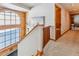 Bright hallway with a large arched window and wood trim detailing at 351 Kimmes Ln, Breckenridge, CO 80424