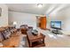 Comfortable living room with rustic decor, plush seating, and a view into an adjacent dining area at 351 Kimmes Ln, Breckenridge, CO 80424