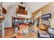 Open-concept living room showcasing wood accents, a modern kitchen, dining area, and inviting leather seating at 351 Kimmes Ln, Breckenridge, CO 80424