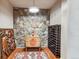 Basement wine cellar with stone wall accent and rustic decor at 351 Kimmes Ln, Breckenridge, CO 80424