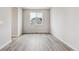 Bright dining room with gray vinyl flooring and a window at 5700 Ranch St, Mead, CO 80504