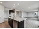 Open concept kitchen and dining area with island and hardwood floors at 5700 Ranch St, Mead, CO 80504
