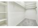 Walk-in closet with built-in shelving and ample storage space, perfect for organizing clothes at 7777 E 23Rd Ave # 401, Denver, CO 80238
