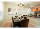 Dining area is adjacent to the kitchen, with bright light and modern accents and table setting at 7777 E 23Rd Ave # 401, Denver, CO 80238