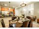 Dining area is adjacent to the kitchen and features an elegant chandelier, and table setting at 7777 E 23Rd Ave # 401, Denver, CO 80238