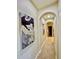 Neutral hallway with decorative art and archway details for added style at 7777 E 23Rd Ave # 401, Denver, CO 80238