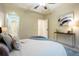 Serene main bedroom with an ensuite bathroom entrance, tray ceiling, and a console table at 7777 E 23Rd Ave # 401, Denver, CO 80238