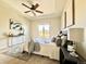 Cozy main bedroom with a tray ceiling, stylish decor, and a private balcony entrance at 7777 E 23Rd Ave # 401, Denver, CO 80238