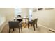 Bright office space with neutral walls, a modern desk, and two comfortable guest chairs at 7777 E 23Rd Ave # 401, Denver, CO 80238