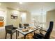 Loft with a dedicated office space featuring a modern desk and comfortable guest seating at 7777 E 23Rd Ave # 401, Denver, CO 80238