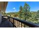Spacious balcony overlooking lush green trees and landscapes, perfect for relaxing or entertaining at 251 Ridgeview Ln, Boulder, CO 80302
