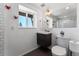 Modern bathroom with stylish vanity, white subway tile, and unique red accents at 251 Ridgeview Ln, Boulder, CO 80302