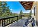 Deck with wooded view and mountain view with outdoor seating at 251 Ridgeview Ln, Boulder, CO 80302