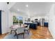 Cozy dining area with a table, hardwood floors, and an adjacent modern kitchen at 251 Ridgeview Ln, Boulder, CO 80302