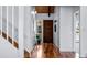 Bright entryway with hardwood floors, a wood front door, and staircase leading to the upper level at 251 Ridgeview Ln, Boulder, CO 80302