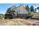 Hillside home featuring an expansive deck with stone walkway and natural surroundings at 251 Ridgeview Ln, Boulder, CO 80302