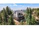 Stunning mountain home with wrap-around deck and picturesque views from a wooded lot at 251 Ridgeview Ln, Boulder, CO 80302